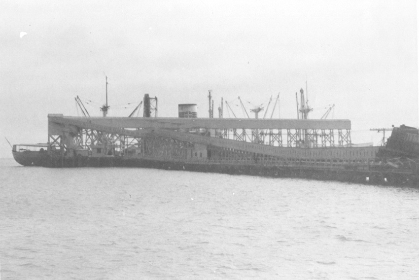 black and white photo of the SS ALCOA RANGER in port loading phosphate