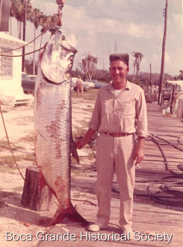 faded color photograph of Bo Smith posing with his tarpon catch